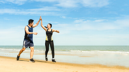 couple runners jump and touch hands And congratulate when able to practice according to the exercise program