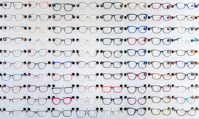 dioptric glasses on the shelf of an optometric clinic and glasses store