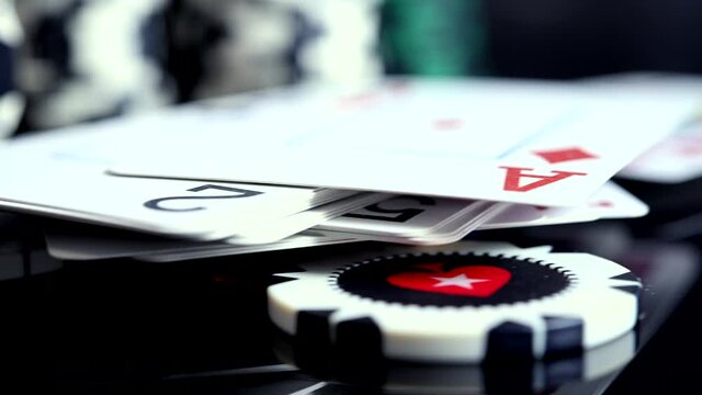 Gambling Concept With Close Up View Of Poker Tokens And Playing Cards On Black Table. 