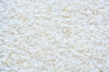 Basmati white rice solid texture. Top view close-up on raw rice grains.