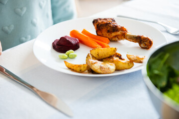Served table with healthy vegetablesbowl with soybeans, avocado, carrot, beetroot  and baked potato