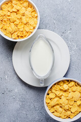 Corn flakes and milk. Healthy diet. Flat top view. Copy space