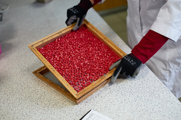 work with a sieve for sifting grains of different sizes work in an agricultural laboratory