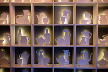 souvenir shop window. Various crockery standing in shelves