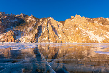 Beautiful crack that goes beyond the horizon on the ice of lake Baikal.