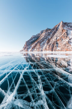 Beautiful crack that goes beyond the horizon on the ice of lake Baikal.