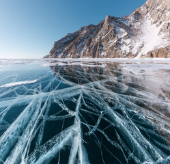 Transparent ice on Lake Baikal near Ogoy island. Siberia, Russia