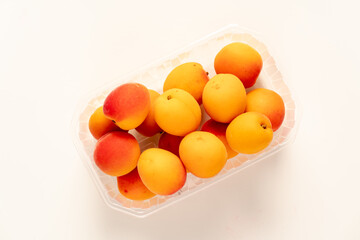 peaches in plastic packaging from a supermarket.