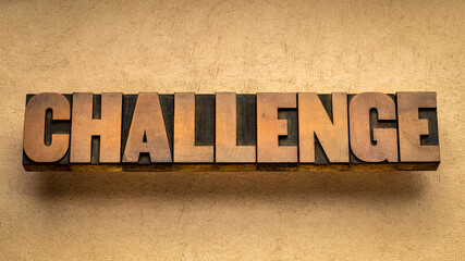 challenge word abstract in vintage letterpress wood type against textured handmade paper