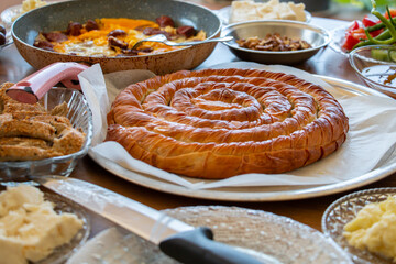 morning breakfast delicious foods, pastry. sausage egg and olives.