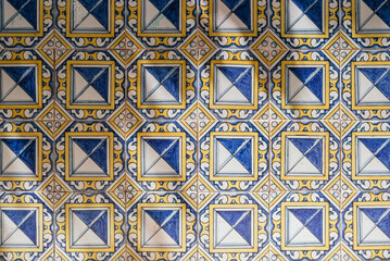 Wall texture of antique colored tiles from Seville, Andalusia. Horizontal photography