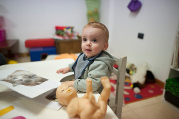 A six months old premature photographed during an early stimulation session.