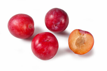 Red plum fruits isolated on white