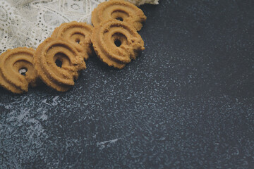 Cookies on a black background have free space.