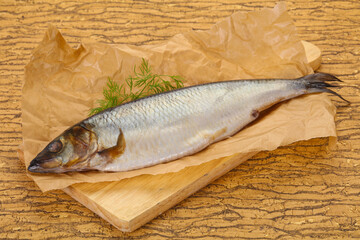 Salted herring over the wooden board