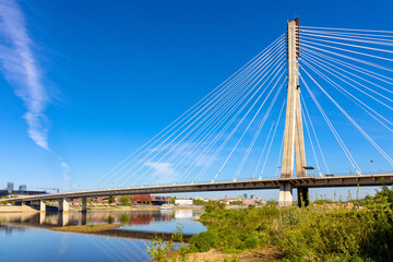 Fototapeta na wymiar Panoramic view of Swietokrzyski Bridge - Most Swietokrzyski - linking Powisle and Praga Polnoc districts over Vistula river in Warsaw, Poland