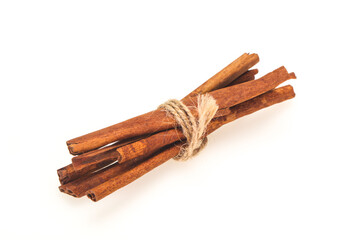 Cinnamon sticks heap isolated on white