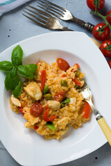 Rice and chicken breast cooked in tomato sauce.