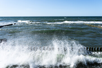 splashing waves of Baltic Sea, waves braking through cutwater 