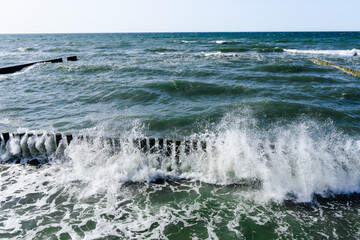 splashing waves of Baltic Sea, waves braking through cutwater 