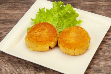 Vegan cuisine - Potato cutlet in the plate