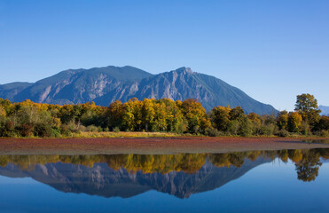 Mt Si and Mill Pond with reflections in autumn in Snoqualmie, WA
