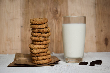 milk and cookies on wooden table