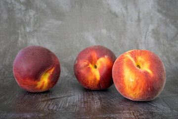 Fototapeta na wymiar Three Peaches with Room for Copy