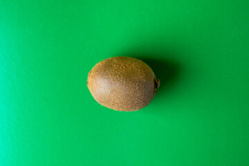 kiwi on a green background. Photo from above. Kiwi as a background. Exotic fruit