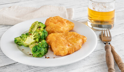 Battered fish with broccoli