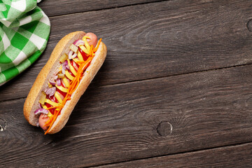 Hot dog with vegetables and condiments
