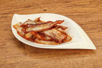 Roasted juicy bacon in the plate