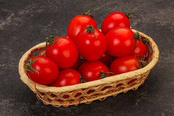 Ripe juicy cherry tomato in the bowl