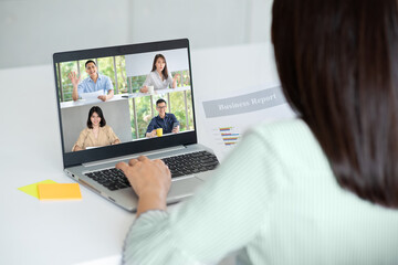 Back view of Business woman using laptop with black screen in office. Photo design with copy space for mock up for business concept