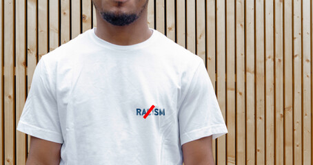 Dark Skinned Man In White T Shirt With No Racism Inscription. Tolerance and Social Equality.