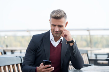 Internet connection. Useful application. Business communication. Send message. Mobile lifestyle. Online communication. Modern communication. Businessman hold mobile phone. Handsome man with phone