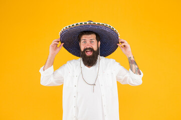 Time to relax. vacation concept at resort in mexico. hipster with beard looks festive in sombrero. happy brutal male celebrating fiesta. guy in poncho. sombrero party man. man in mexican sombrero hat © be free