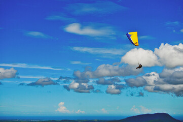 Naklejka na ściany i meble Paraglide in a blue sky