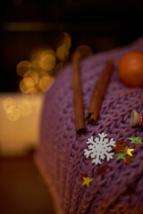 Photo for the New Year card. New Year's composition. View from above. Warm knitted scarf in purple. Tangerines lie on a scarf. Christmas composition with tangerines and a scarf.