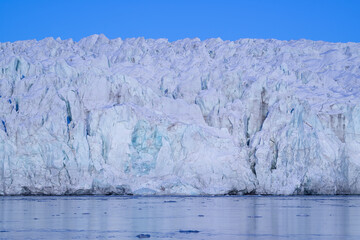 Glacier front with blue sky in the Arctic, on Spitsbergen