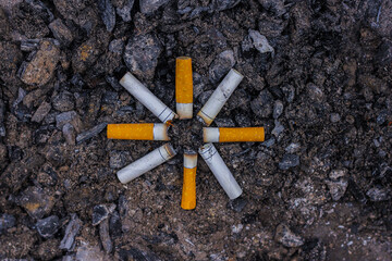 cigarette butts in the form of a sun. the concept of the depressive world of the smoker