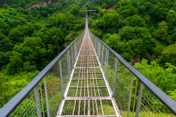 Walk on the suspension bridge over the Khndzoresk gorge, a tourist attraction in Armenia