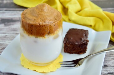 dalgona coffee, fluffy creamy whipped coffee, served with brownie