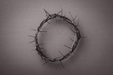 Fototapeta Crown of thorns over grey background. Top view. Copy space. Christian Easter concept. Crucifixion of Jesus Christ. He risen and alive. Jesus is the reason. Gospel, salvation obraz
