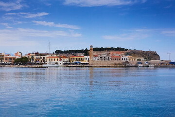 Fototapeta na wymiar Beautiful view at the venetian lighthouse in the harbour of Rethymno