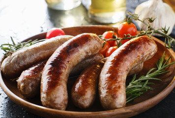 Fototapeta plate of german bratwurst sausages with herbs obraz