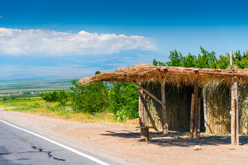 Thatched canopy from the sun on the highway of Armenia