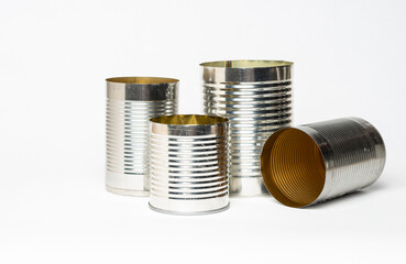 Empty metal cans against a white background