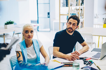 Obraz premium Pensive woman and man students of business school on training lesson