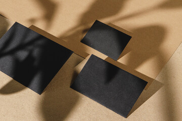 Black business cards on cork board table